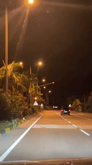 Nighttime traffic observed on lit road in Fethiye, Turkey