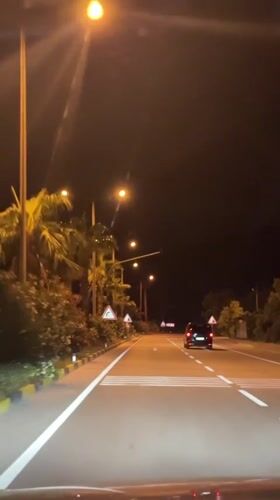 Nighttime traffic observed on lit road in Fethiye, Turkey