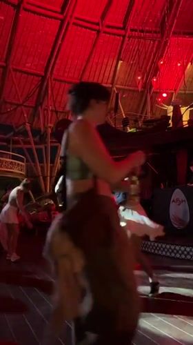 Nightclub scene with dancing and DJ performance in Kediri