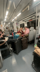 Street performer sings on Barcelona train