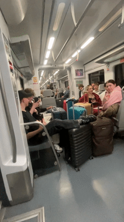 Street performer sings on Barcelona train