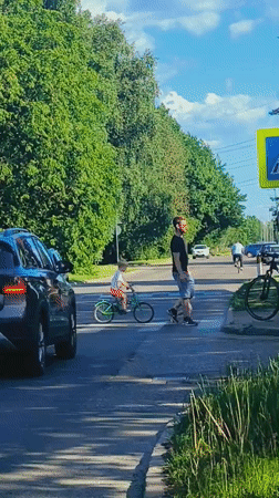 Woman takes car selfie on sunny Riga street