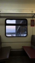 Train passenger films river bridge view in Perm