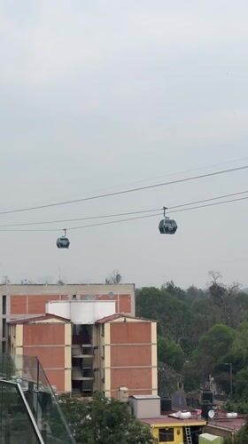 Cable cars operate across Mexico City amid routine daily life