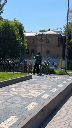 Armed soldiers march in formation through Yerevan streets