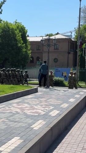 Armed soldiers march in formation through Yerevan streets