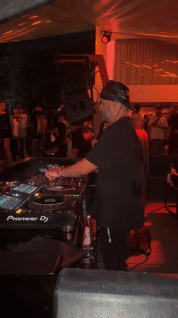 Nighttime beach party with DJ documented in North Kuta
