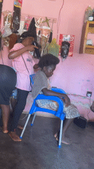 Hair styling session captured at Akwanga salon