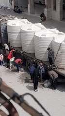 Water distribution draws crowds in Khan Yunis, Palestine