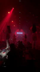 Red-lit nightclub show in Bali with 'Anderson' branding on stage