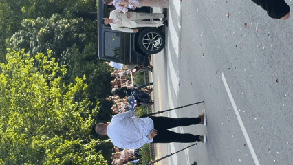 Couple poses by SUV draws crowd in Bulgarian street