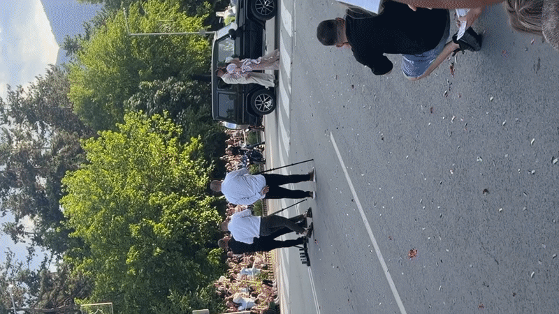 Couple poses by SUV draws crowd in Bulgarian street
