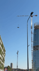 Construction cranes active at Milan skyscraper site Tuesday morning