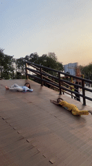 Kids playing on a wooden ramp structure at a Sidoarjo park