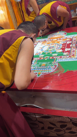 Masked monks create sand mandala at Dharamshala monastery