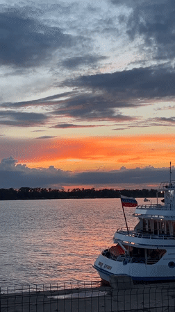 Sunset on the Volga with cruise ship Ivan Bunin docked nearby