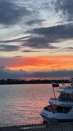 Sunset on the Volga with cruise ship Ivan Bunin docked nearby