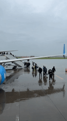 Rainy day boarding onto a Pobeda flight at Perm Airport