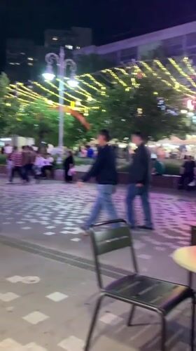 Nighttime scenes captured across central Almaty square and streets