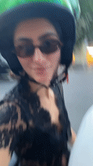 Scooter passengers film selfies during Madrid ride