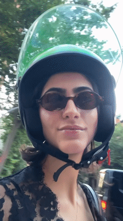 Scooter passengers film selfies during Madrid ride