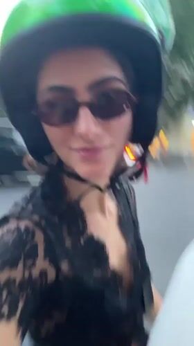 Scooter passengers film selfies during Madrid ride