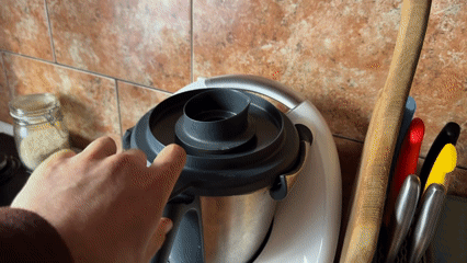 Person operates Thermomix food processor in Târgu Mureș kitchen