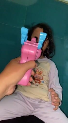 Girl plays with bubbles during morning playtime in Indonesia