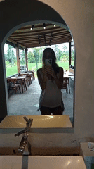 Woman takes bathroom selfies, tree photographed in Bali villages
