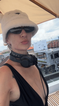 Woman prepares to DJ from balcony in North Kuta