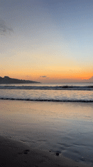 Evening beach life captured at Kuta Selatan during sunset