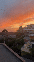 Dusk settles over Šušanj's Adriatic coastline in warm color