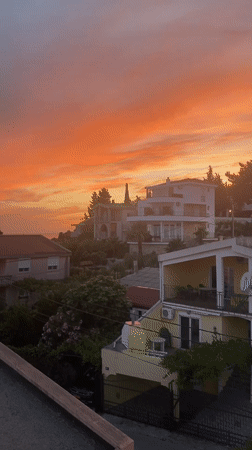 Dusk settles over Šušanj's Adriatic coastline in warm color