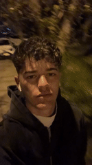 Young man records nighttime selfie video in Sofia streets