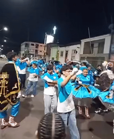 Traditional costume parade with religious imagery occurs in Iquique Chile