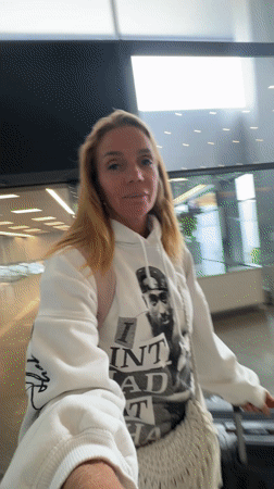 Woman travels through Tashkent airport with TezJet boarding pass