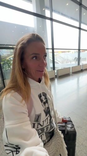 Woman travels through Tashkent airport with TezJet boarding pass