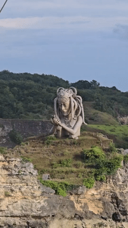 Stone statue with tentacled headdress observed in Nusa Penida