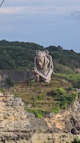 Stone statue with tentacled headdress observed in Nusa Penida