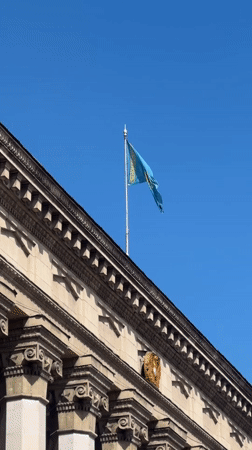 A calm Almaty morning: parks, pigeons, and Kazakh flags