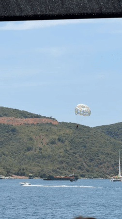 Tourist boat excursion with parasailing activity off Nha Trang coast