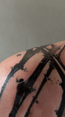 Fresh black abstract tattoo documented in Moscow