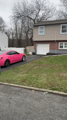 Pink car parks at suburban home in New Windsor