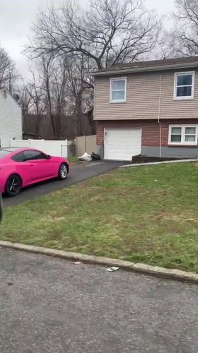 Pink car parks at suburban home in New Windsor