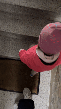Woman takes selfies with child in Kiel building