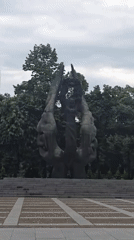Public sculpture of woman with wreath documented in park
