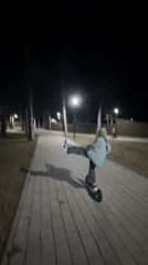 Evening scooter ride captured in illuminated Votkinsk park