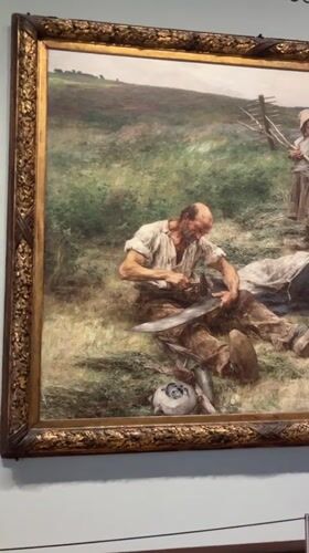 Museum visitor documents historical painting in Amsterdam