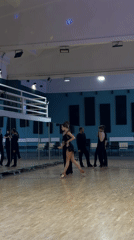 Ballroom dancers practice routines in Moscow studio