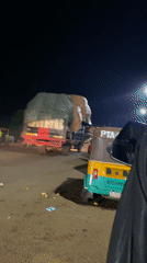 Night scenes from Bukuru: loading, lounging, and card games